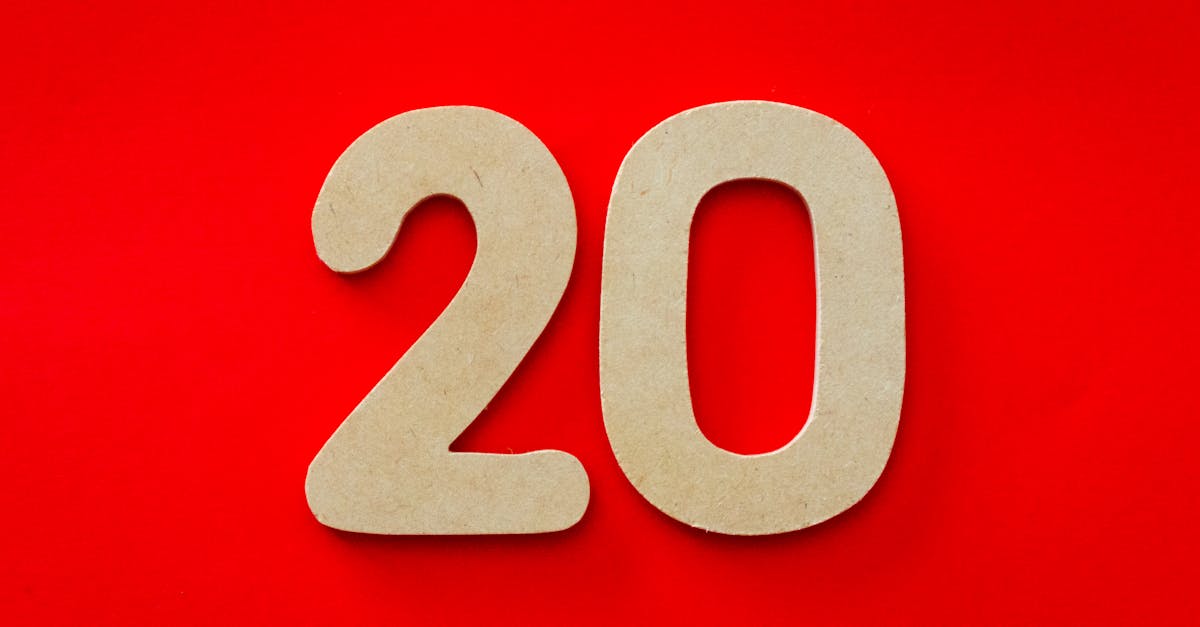 Wooden number 20 on vibrant red background, perfect for design themes.