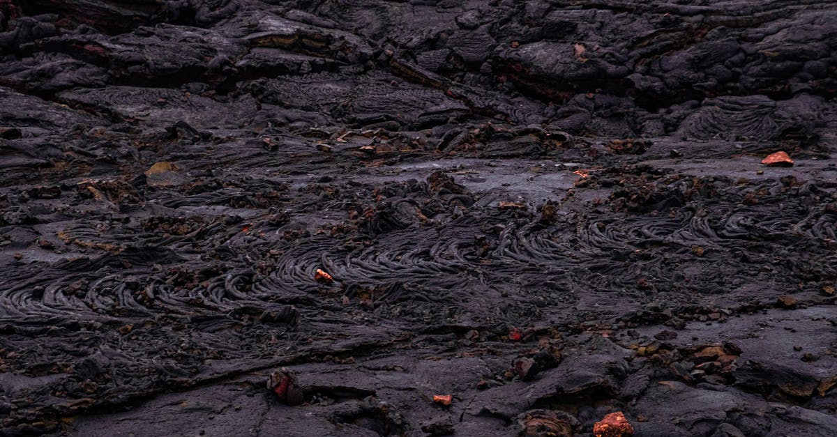 Close-up view of intricate textures on a cooled lava surface, showcasing geological formations.
