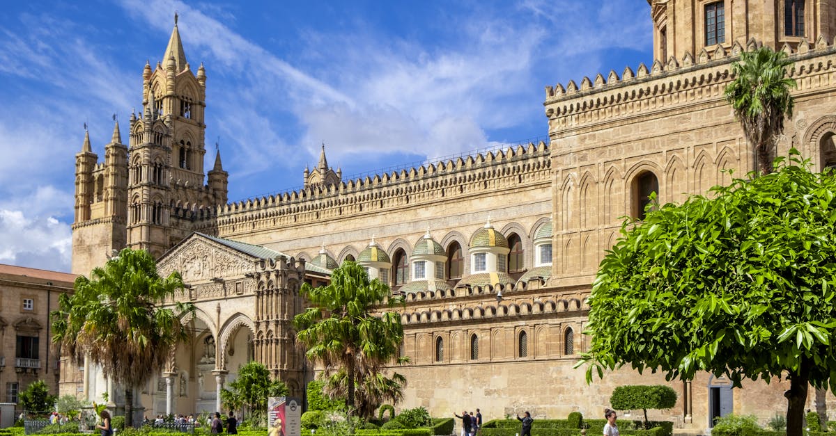 Bright day view of the historic Palermo Cathedral in Sicily, showcasing its impressive architectural details.