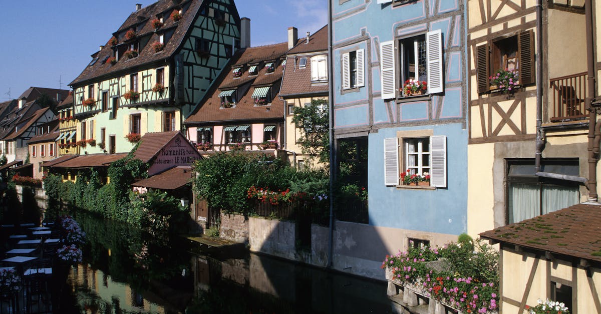 Quaint canal-side houses in La Petite Venise, Colmar, France. A picturesque tourist destination.