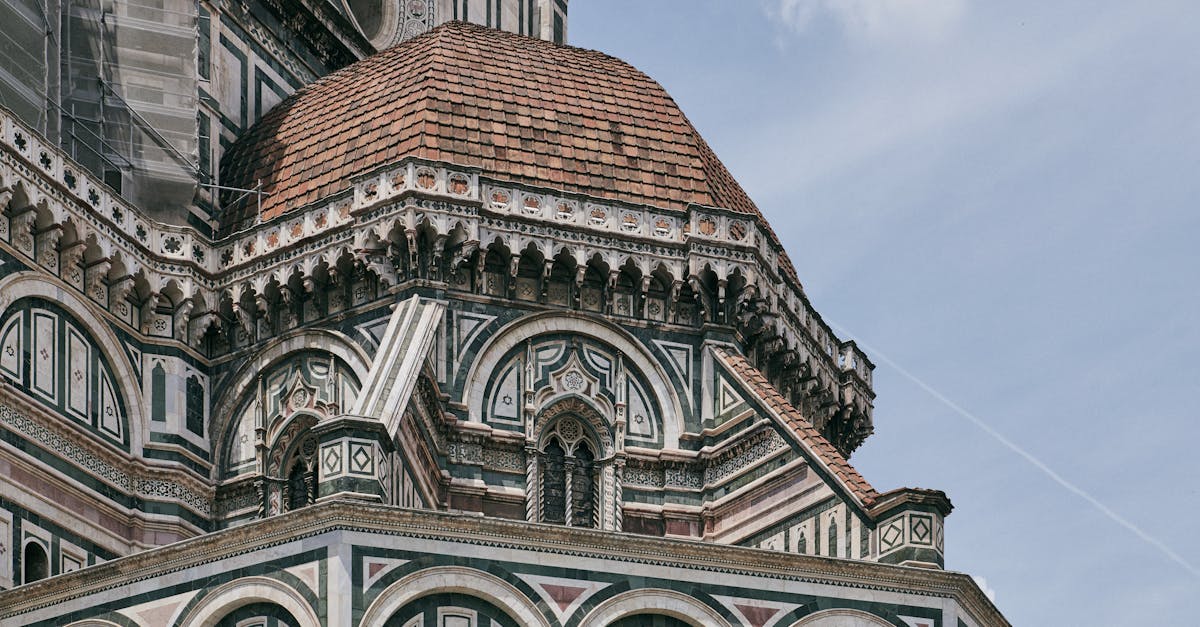 Detailed view of Brunelleschi's Dome on the Florence Cathedral facade, showcasing Renaissance architecture.