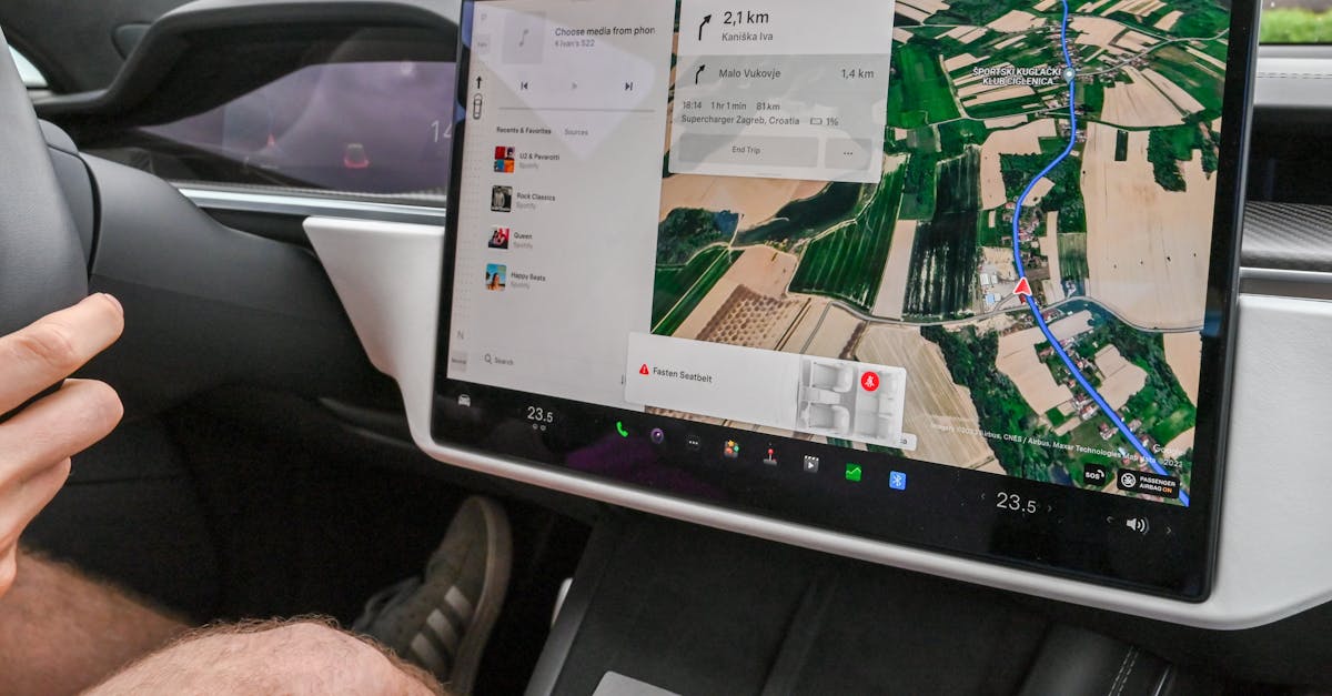 Inside view of a car with a large navigation screen and detailed digital map.