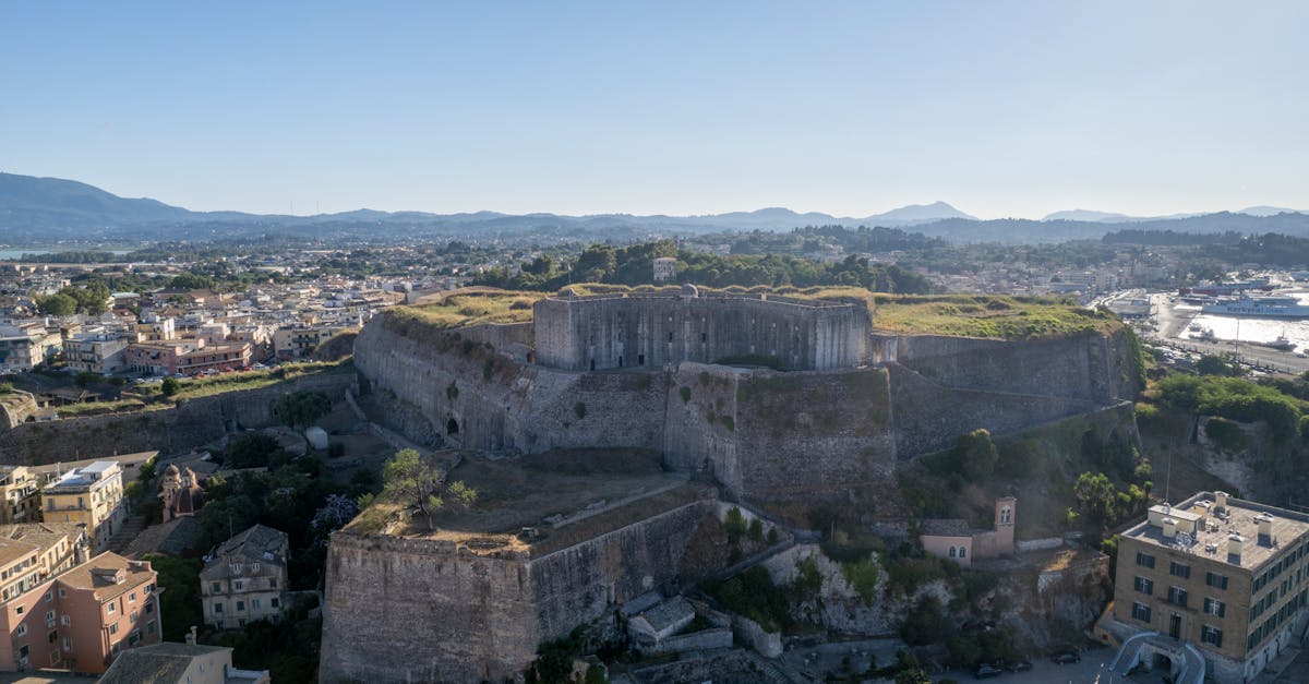 Stunning aerial view of the historic Old Fortress in Corfu, Greece on a sunny day.