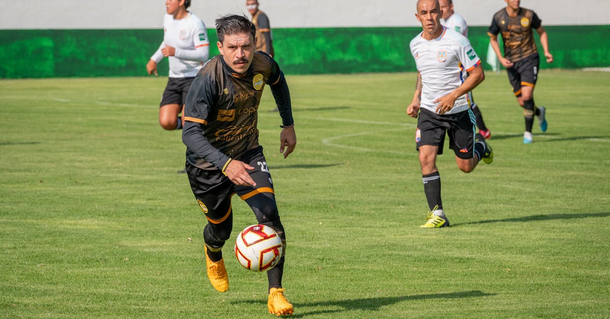 Dynamic soccer match showcasing players in action on a bright green field under clear skies.