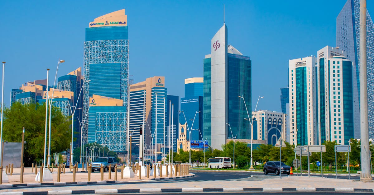 Capture of Doha's towering skyline featuring modern architecture and clear blue skies.