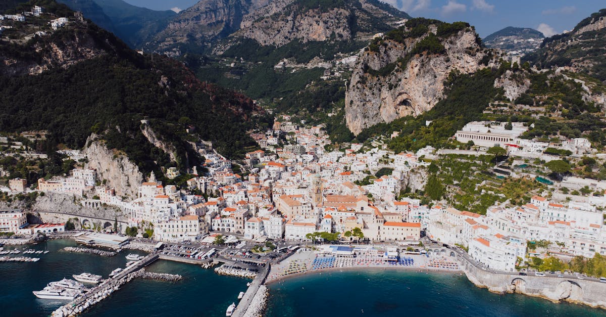 Stunning aerial capture of Amalfi, Italy with scenic coastline and historic architecture.