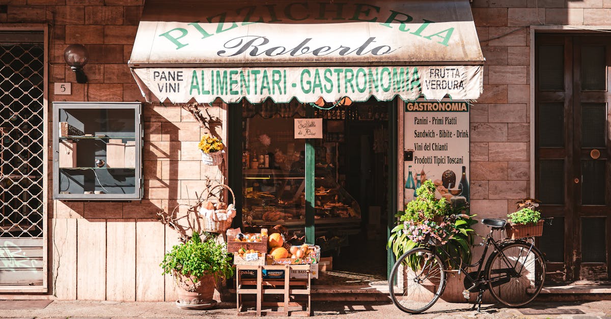 A quaint Italian grocery store with fresh produce and a vintage bicycle outside, offering local delicacies.