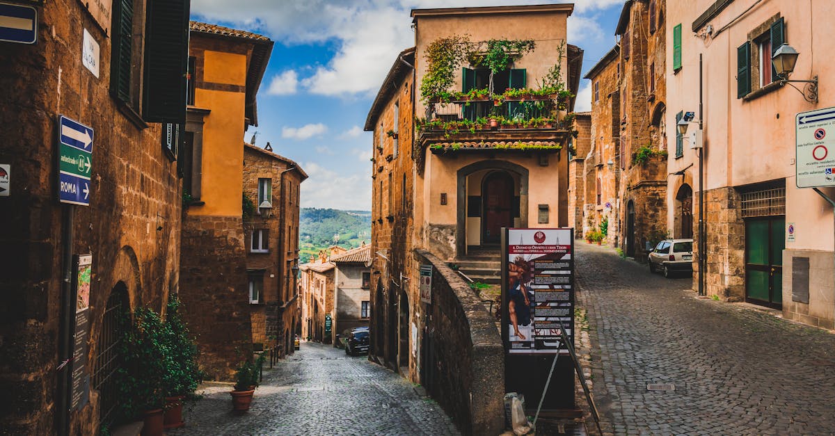 Explore the cobblestone streets and historic architecture of Orvieto, Italy, a picturesque travel destination.