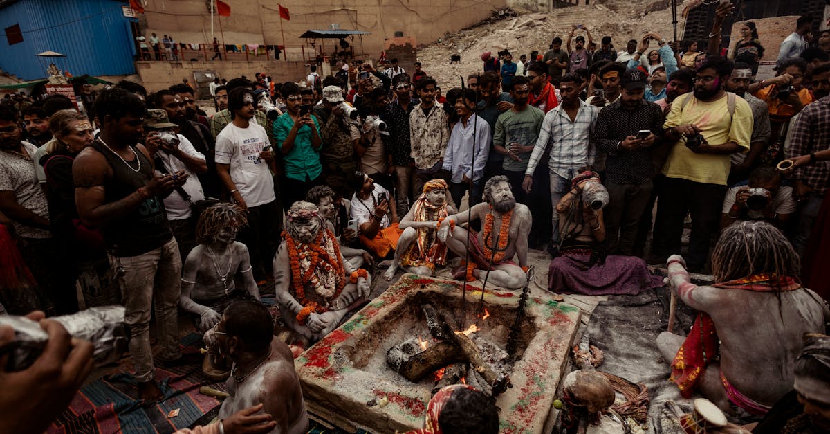 A group of people participates in a traditional ritual around a sacred fire, evoking cultural and spiritual significance.