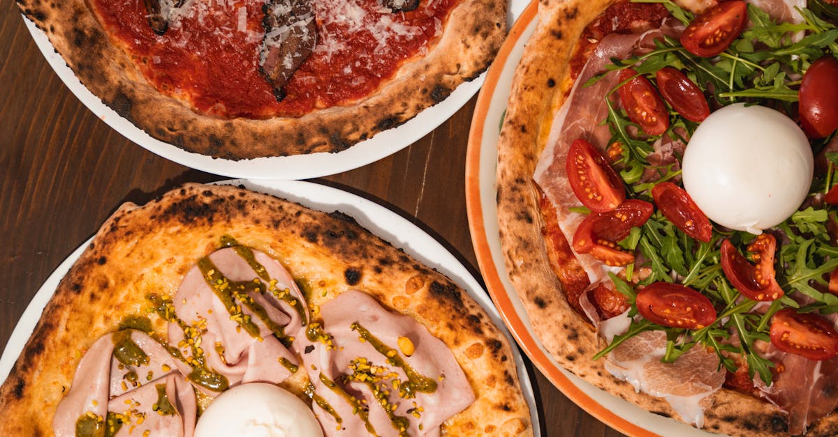 A close-up of various Italian pizzas with gourmet toppings, captured in an indoor Milan pizzeria.