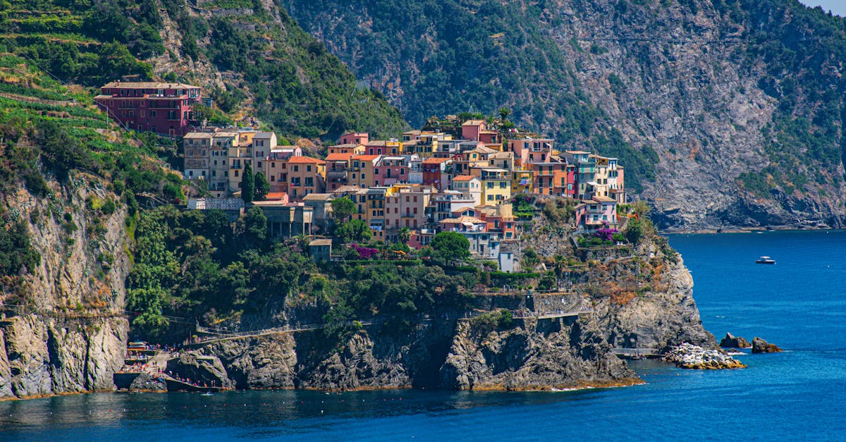 Beautiful aerial view of Corniglia, a picturesque village perched on cliffs overlooking the Ligurian Sea in Italy.