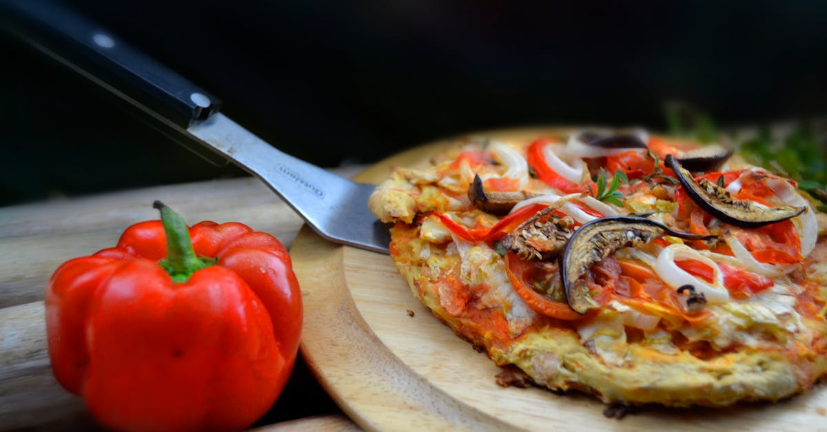 Delicious homemade vegetable pizza with mushrooms, onions, and red pepper. Perfect for dinner or lunch.