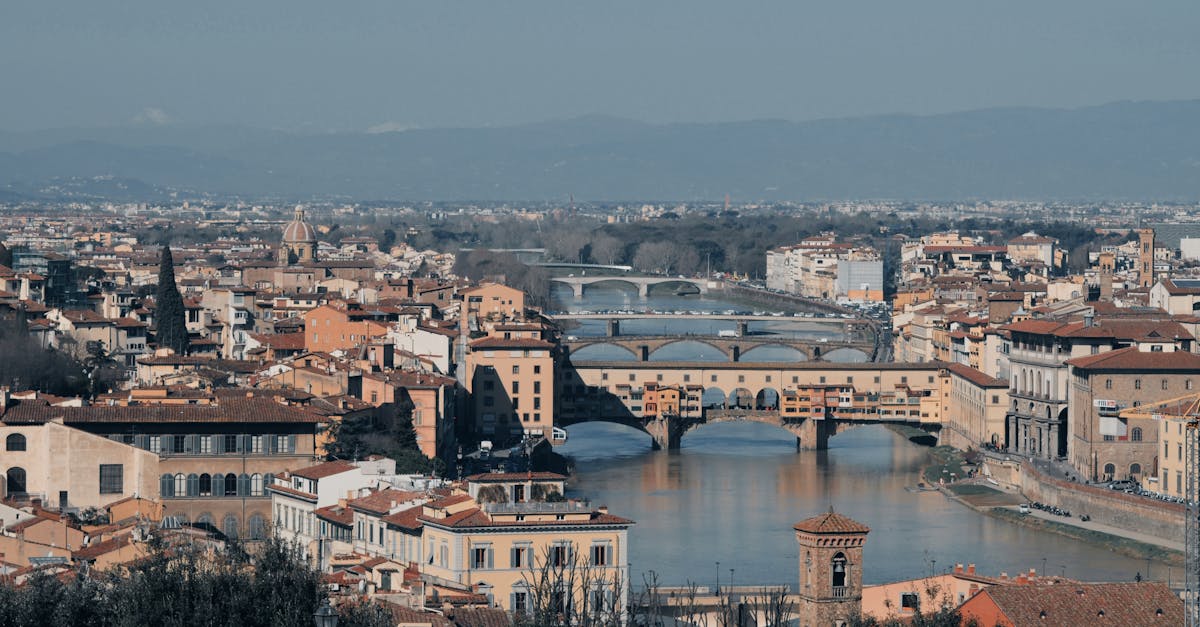Stunning view of Florence featuring the iconic Ponte Vecchio and Arno River.