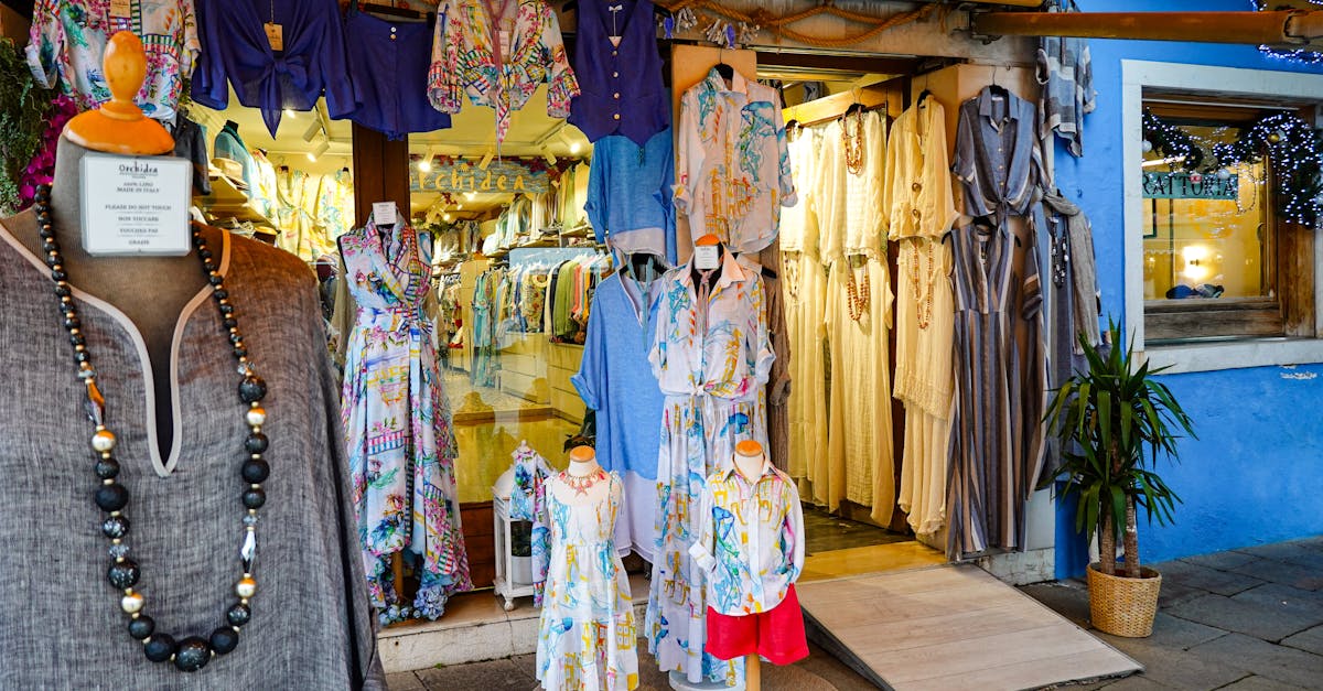 Explore a colorful Italian boutique with stylish dresses and vibrant fabrics on display.