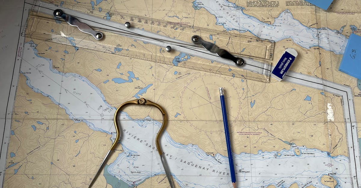Flat lay of nautical chart with navigation tools including a compass, ruler, and pencil.
