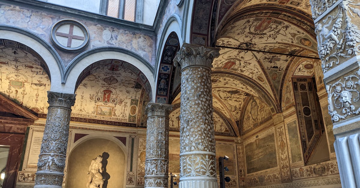 Renaissance architecture and frescoes in the courtyard of Palazzo Vecchio, Florence, Italy, showcasing exquisite details.