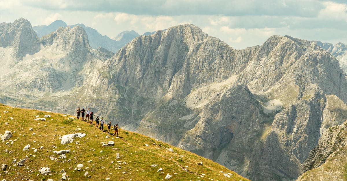 Explore the stunning landscapes of Shkodër County, Albania with a group of hikers in the picturesque mountains.