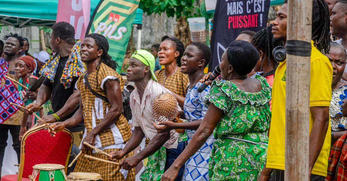 Colorful African festival featuring lively drumming and dancing performers in traditional attire.