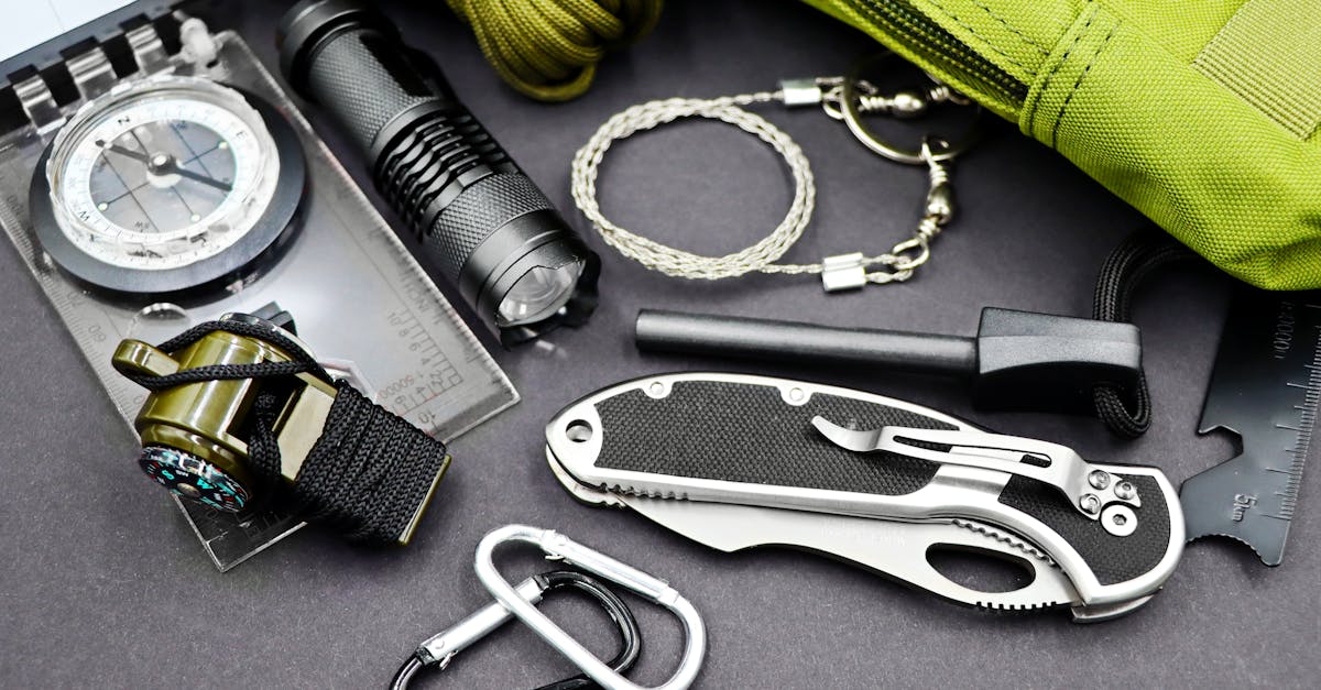 A comprehensive layout of essential survival tools including compass, flashlight, and knife, perfect for outdoor adventures.