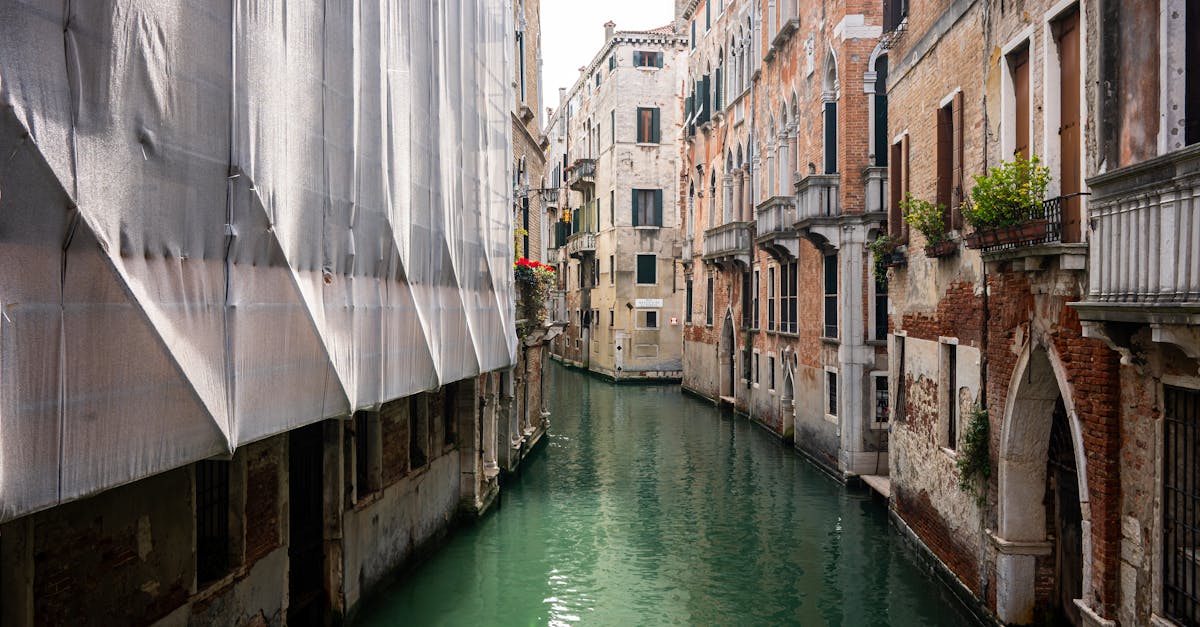 Explore the scenic charm of Venice's historic canals lined with classic architecture.