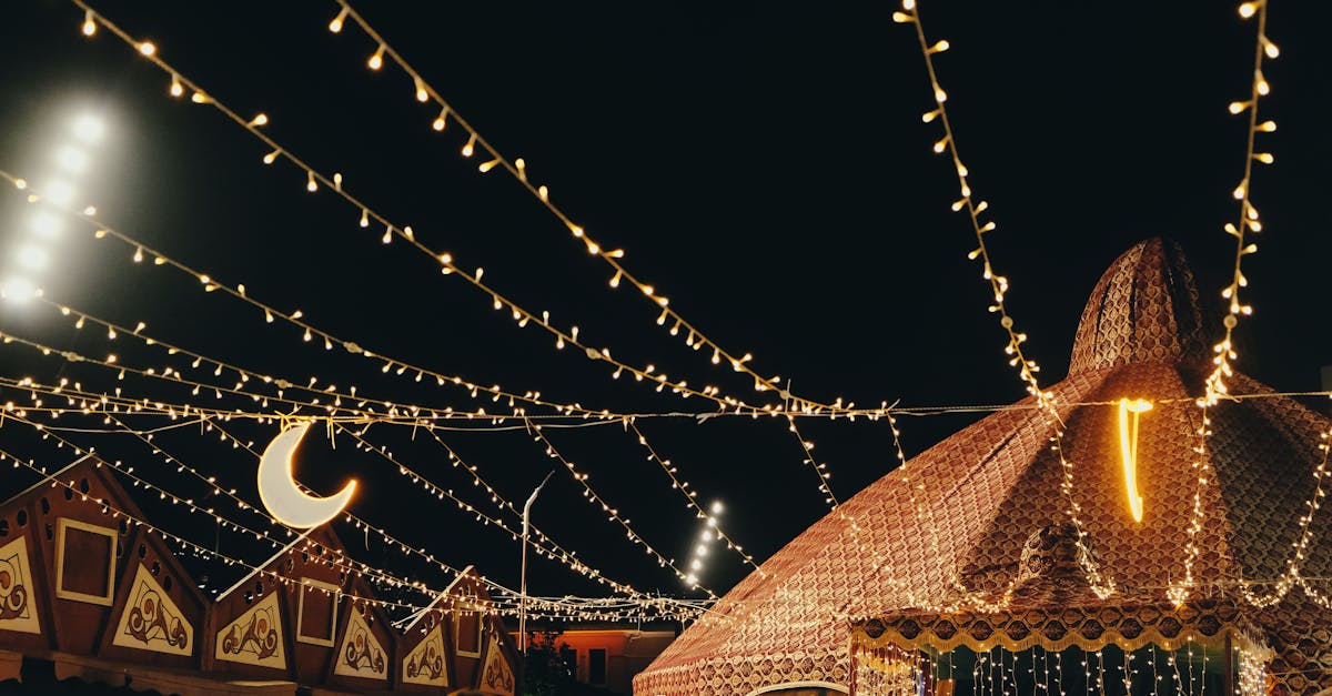 A lively night festival scene with decorative tents and string lights creating a festive atmosphere.