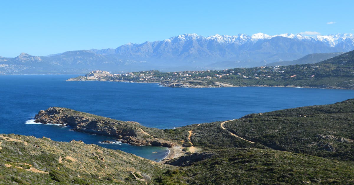 Beautiful view of the Calvi coastline with mountains and the Mediterranean Sea in Corsica, France.
