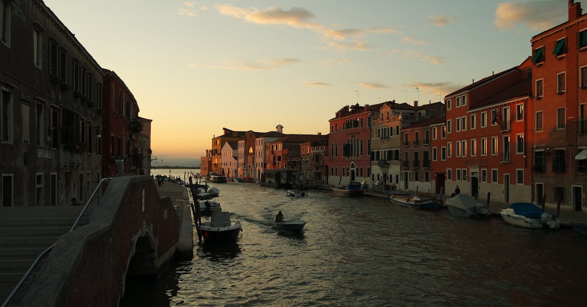 Enchanting sunset view over a Venice canal, capturing vibrant architecture and serene waterway.