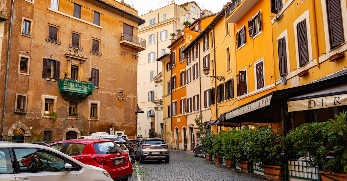 Vibrant historic architecture and parked cars in Largo del Pallaro, Rome, Italy.