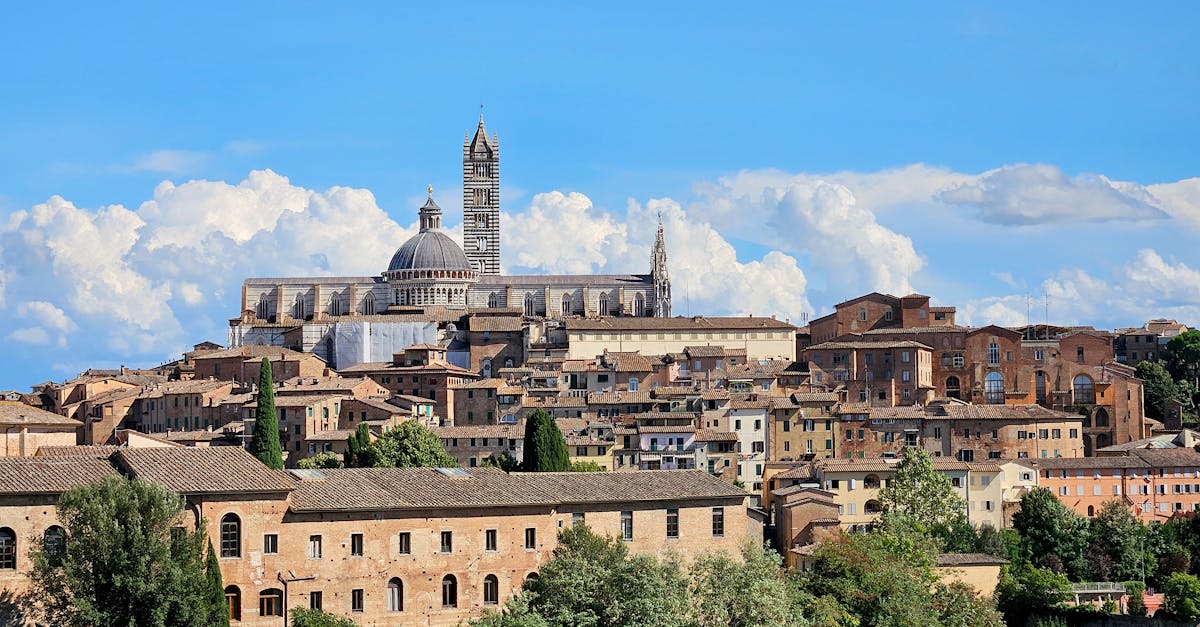 Stunning panoramic view of Siena Cathedral and surrounding medieval architecture in Tuscany, Italy.
