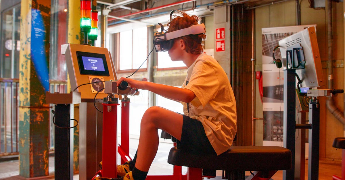 A teenager using a VR headset and control panel in an industrial-style interior setting.