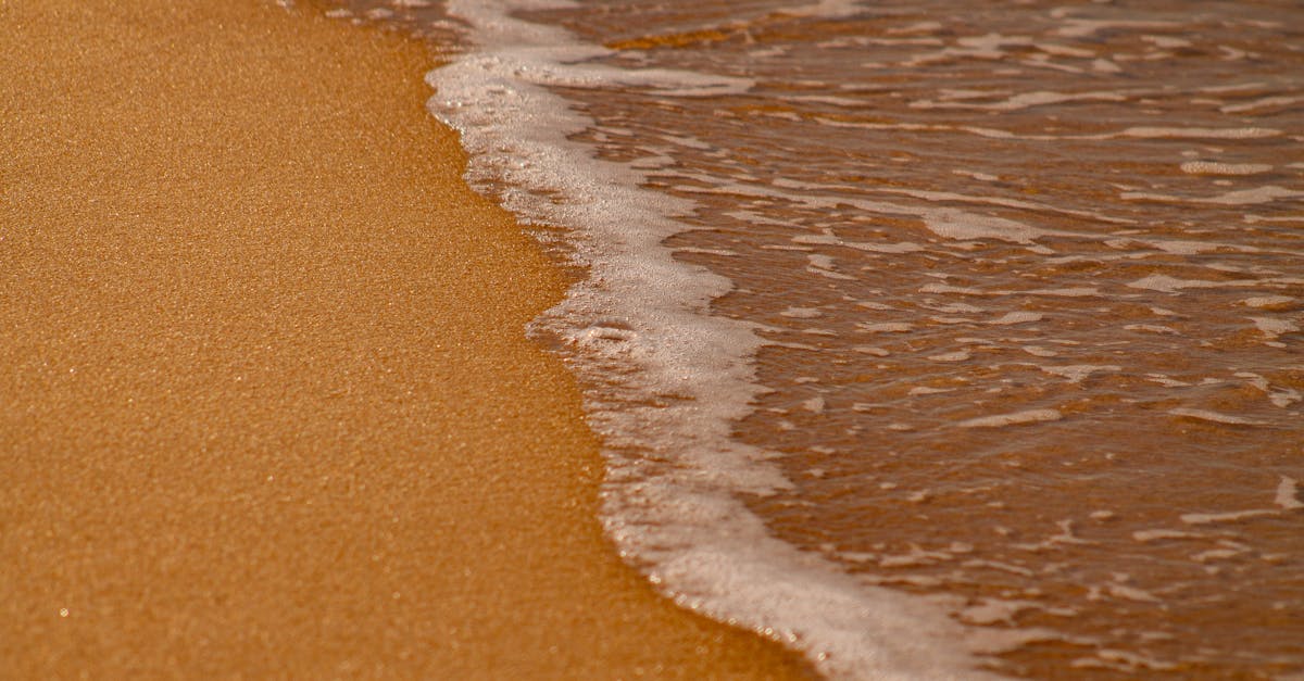 A tranquil beach scene with gentle waves on the sand in Porto Seguro, Brazil.