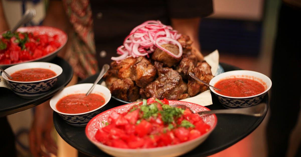 Mouthwatering platter featuring grilled meat with fresh salsa and spicy sauces, offering a delightful dining experience.