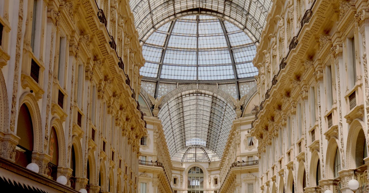 Interior view of the iconic Galleria Vittorio Emanuele II in Milan, showcasing its glass dome and elegant architecture.