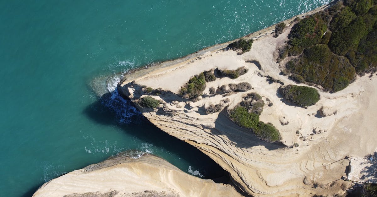 Stunning aerial view of unique cliff formations and turquoise sea in Sidari, Greece.